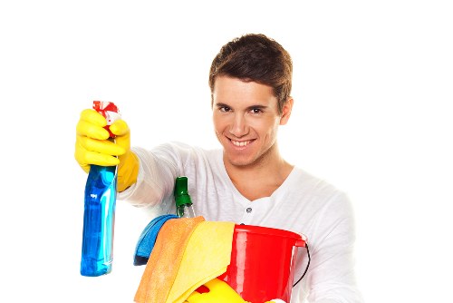 Experienced cleaner vacuuming a family home in Bromley